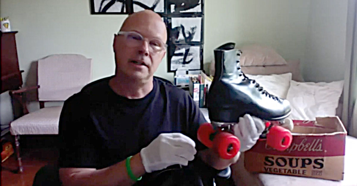 Donald Warhol holding a roller skate